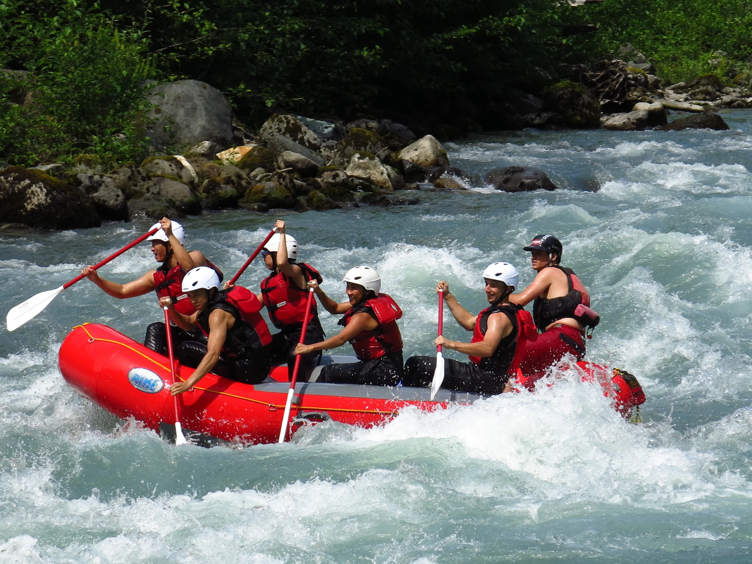 Paddlers break to the right at the end of Whirlpool rapid on the Sauk River