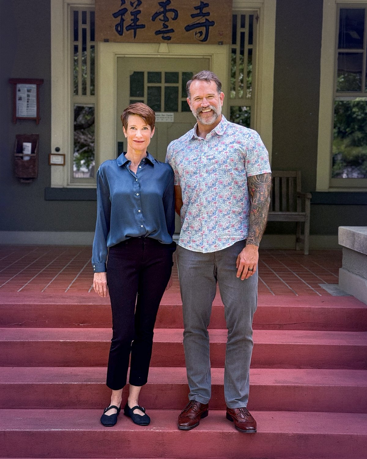 Photo of Jo Sullivan and Wade Maggert standing in front of Houston Zen Center