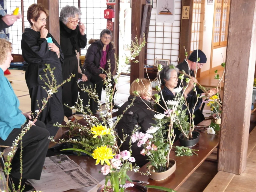 Chitose-san teaches flower arranging to HZC members.