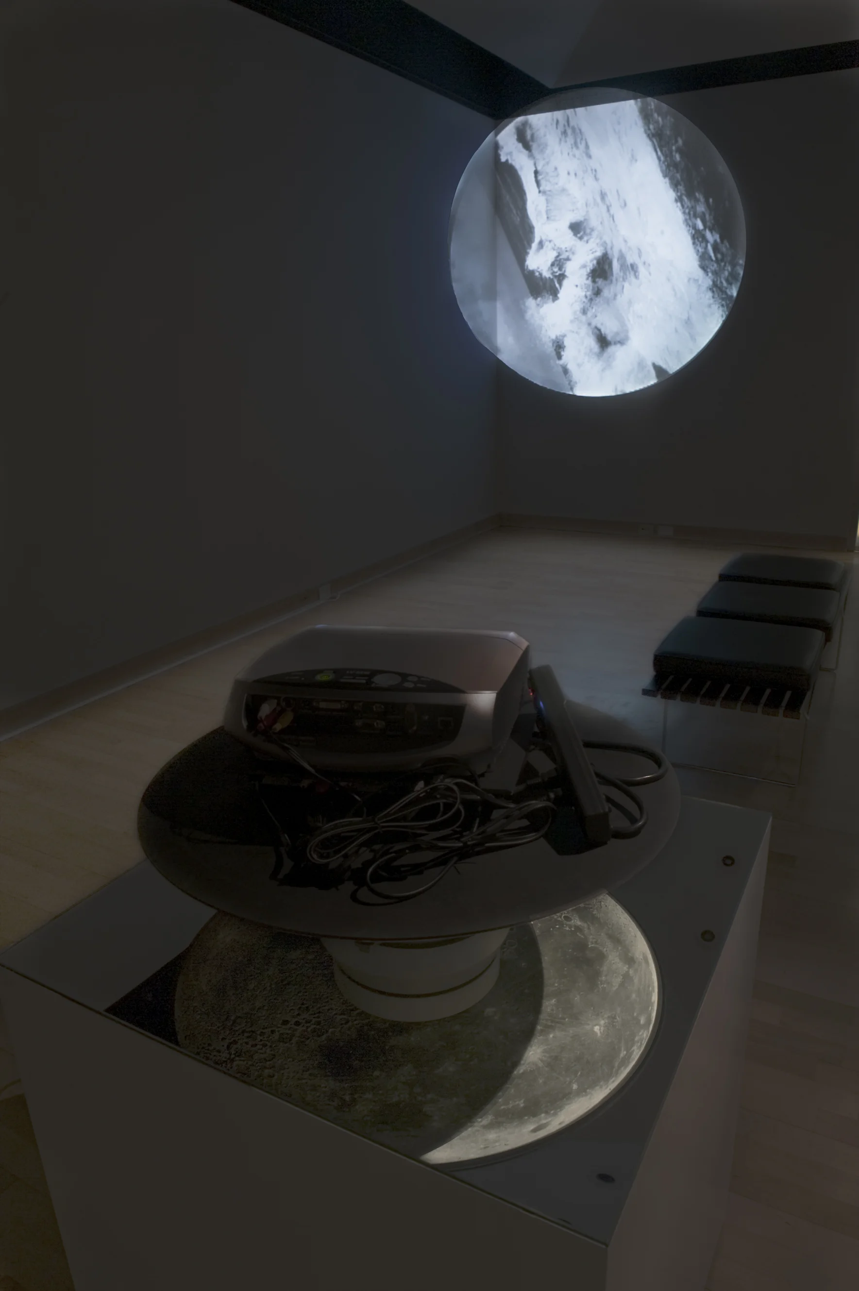 Mare , 2009 turntable, digital projector, curtains, dvd player, video, mirror, c-print