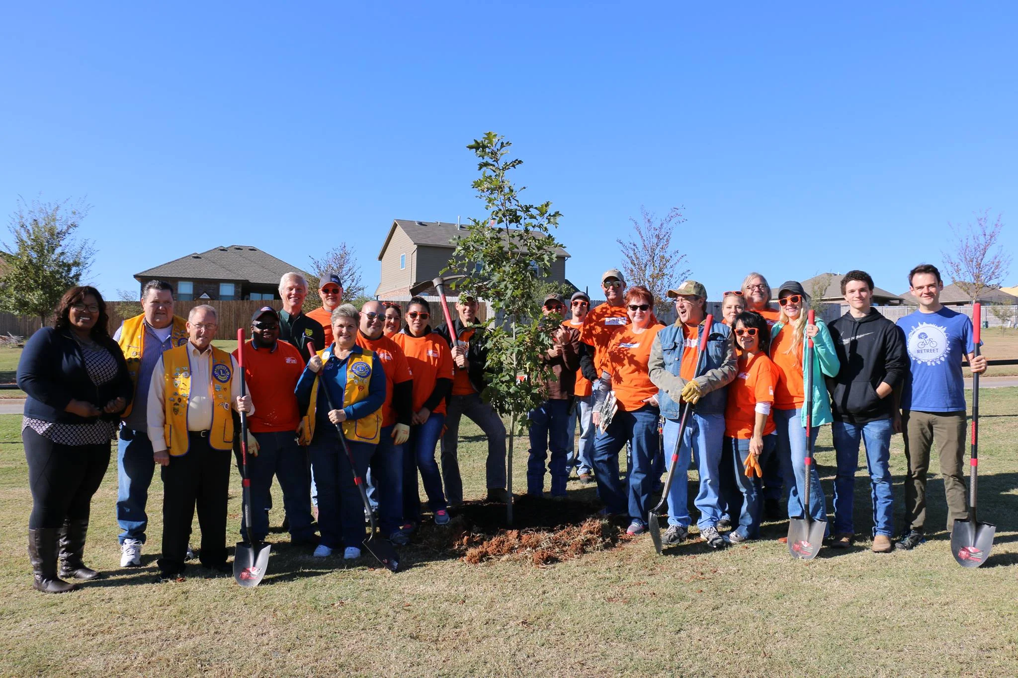 TEAM DEPOT POSES WITH LOCAL MEMBERS OF LIONS CLUB INTERNATIONAL, OKLAHOMA FORESTRY SERVICES, AND RETREET STAFF