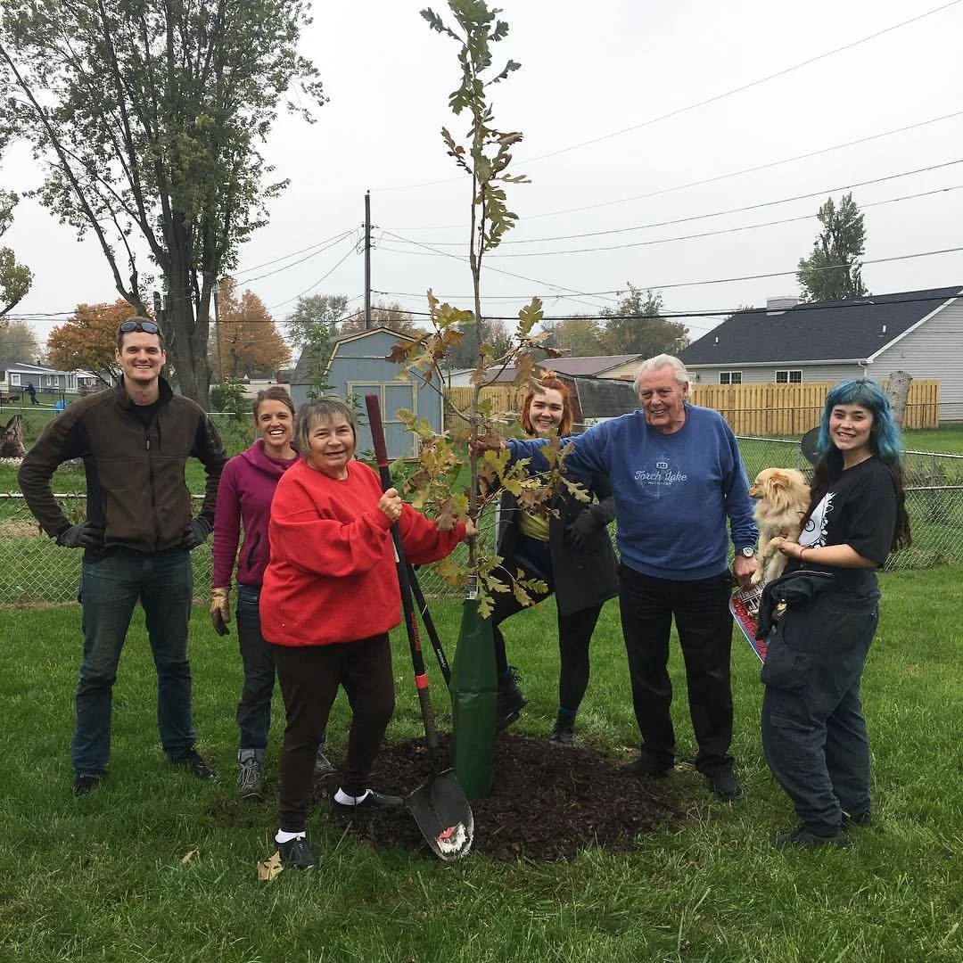 A HAPPY FAMILY IN KOKOMO WITH THEIR NEW TREE