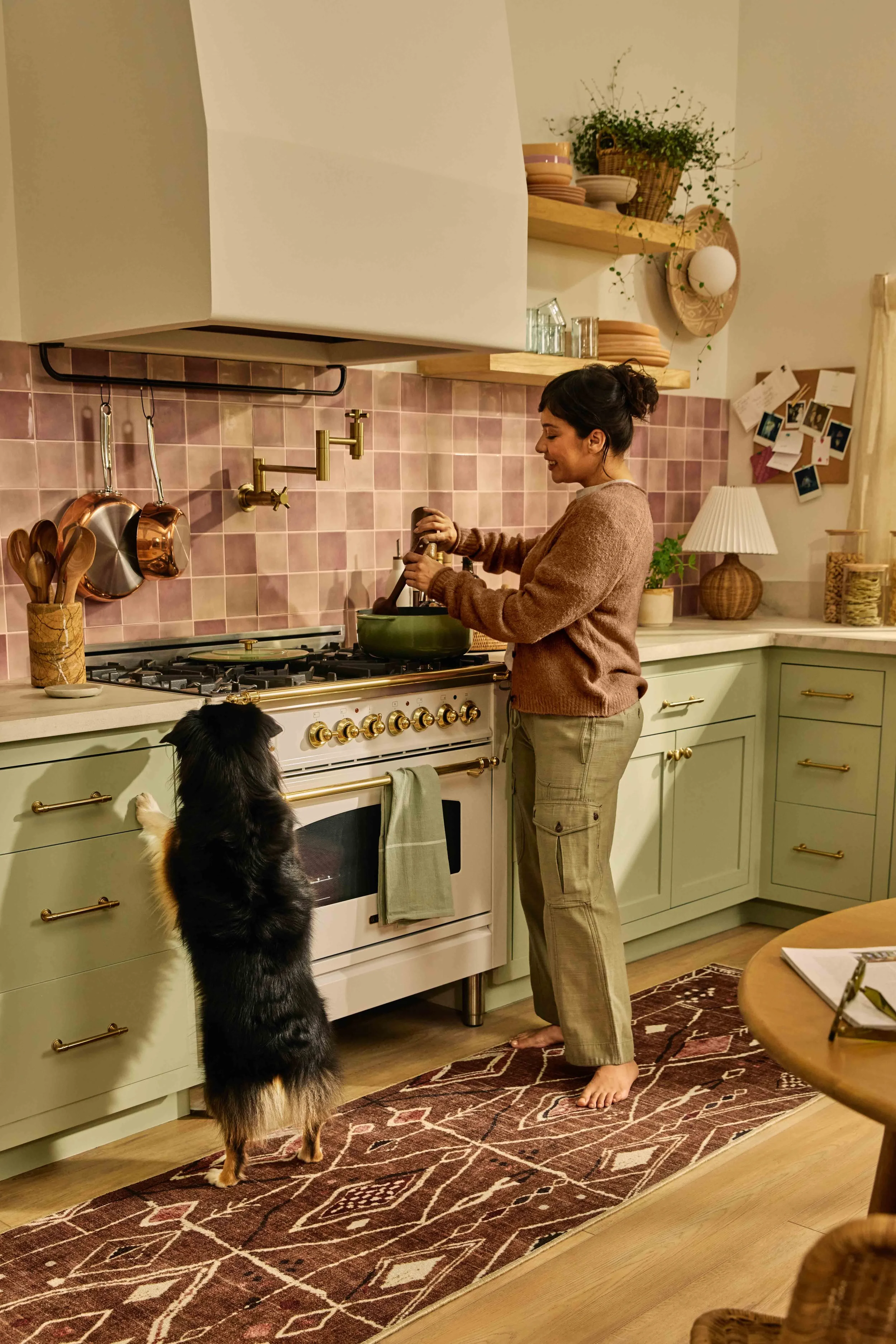 251209BOHO_1484_KIT WOMAN AT STOVE.jpg