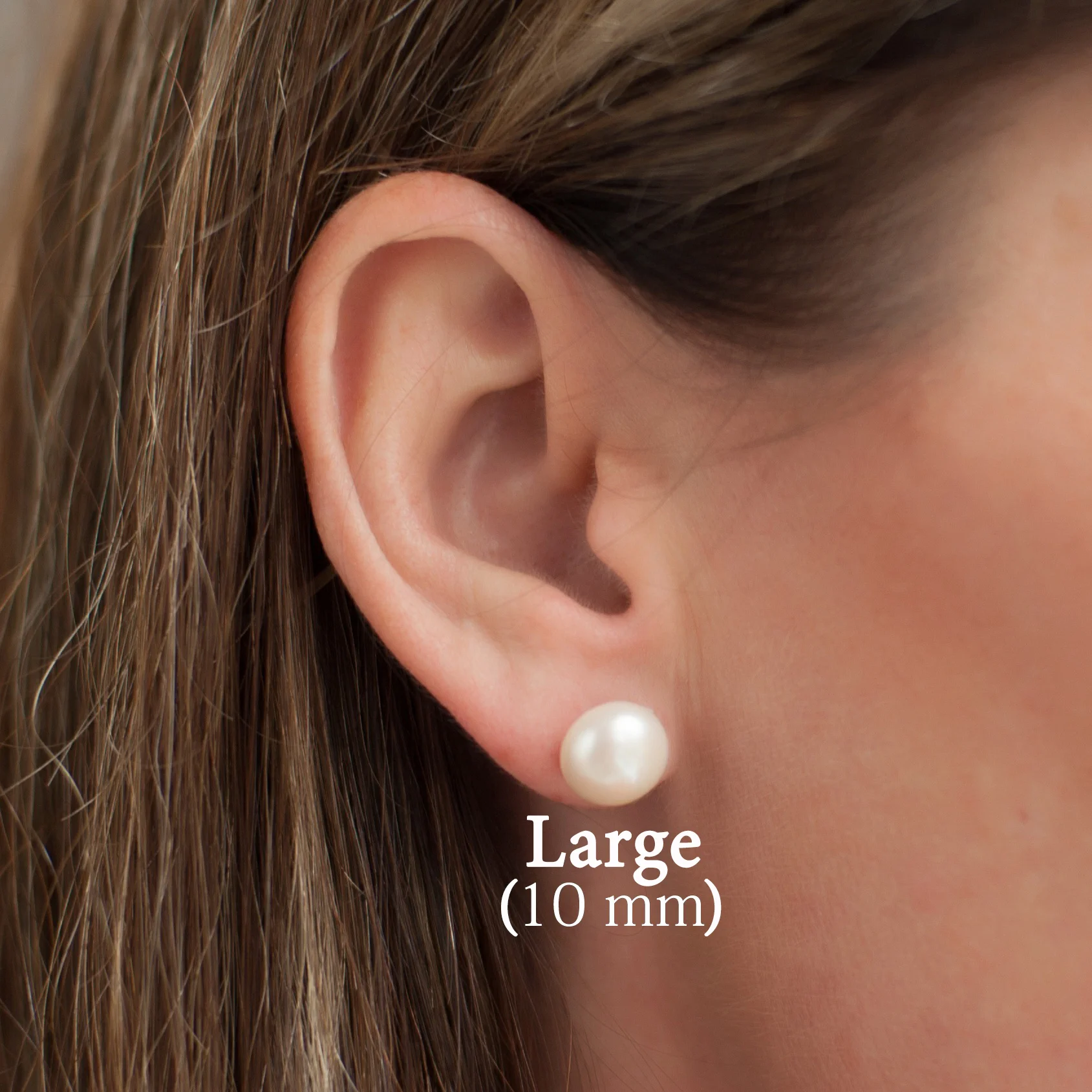 Large-pearl-stud-earrings-on-model.jpg