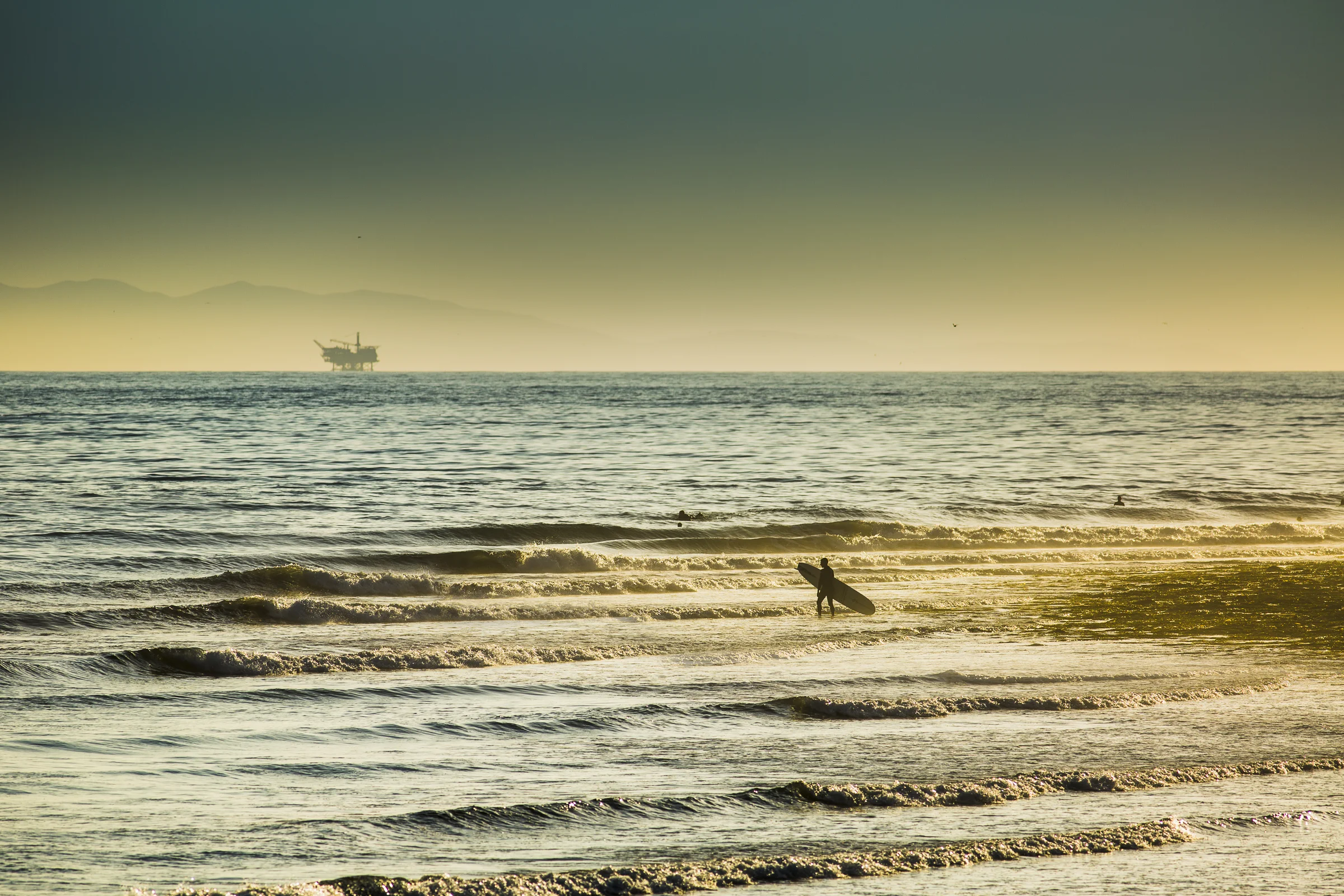  An unknown surfer gets ready to paddle out at Rincon Point, California. Handheld 