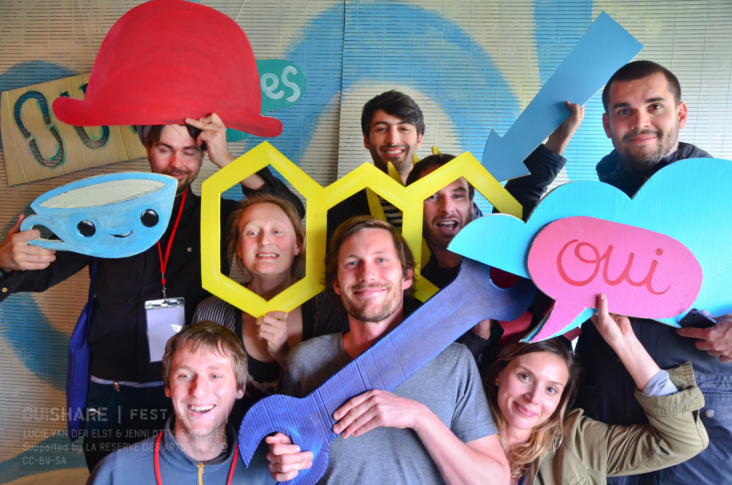 The Open Source Hardware Crew gathering for a picture in the OUIShapes Photo Booth
