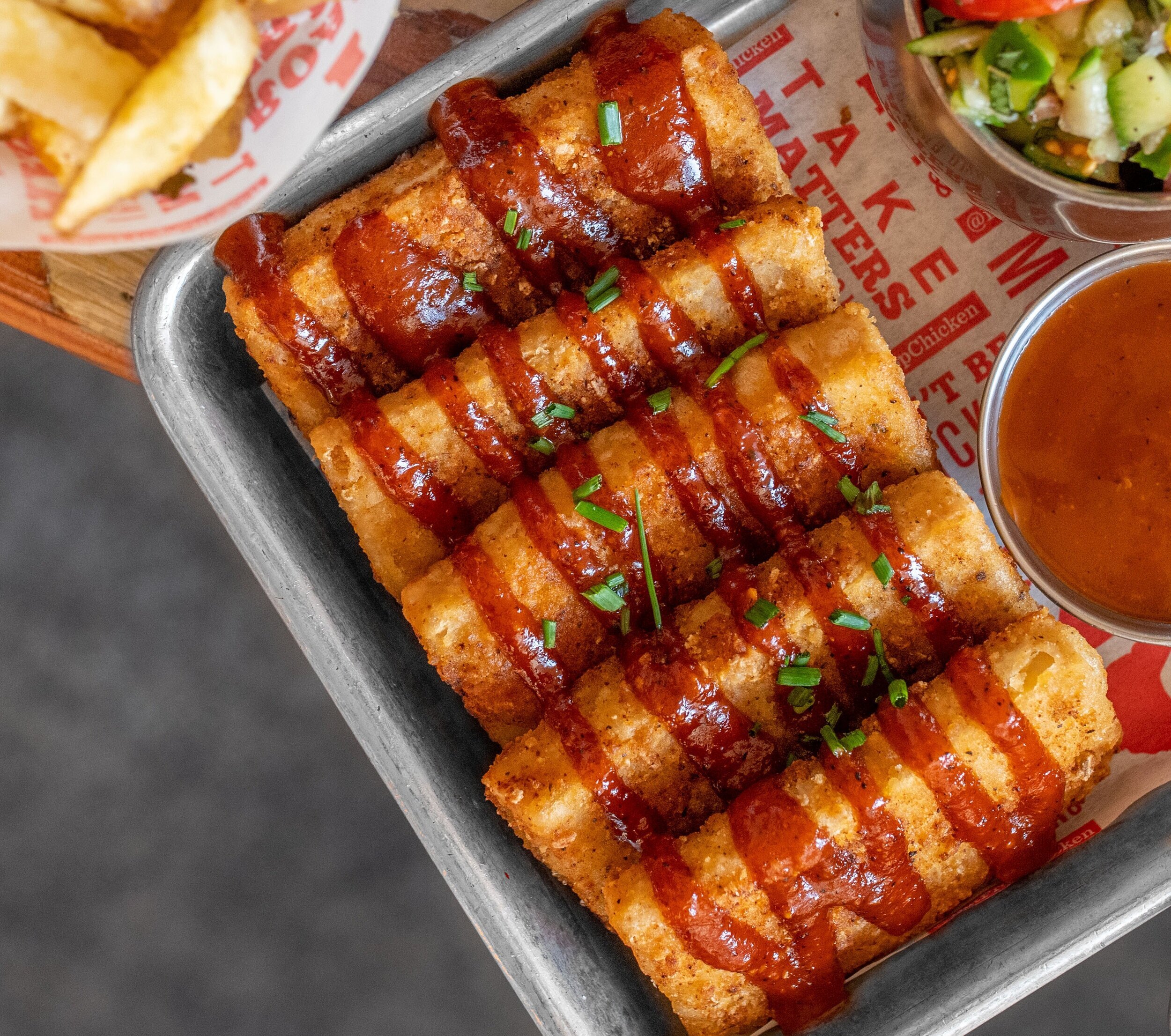 deep fried tofu with drizzle of sauce and a side cucumber salad.jpeg