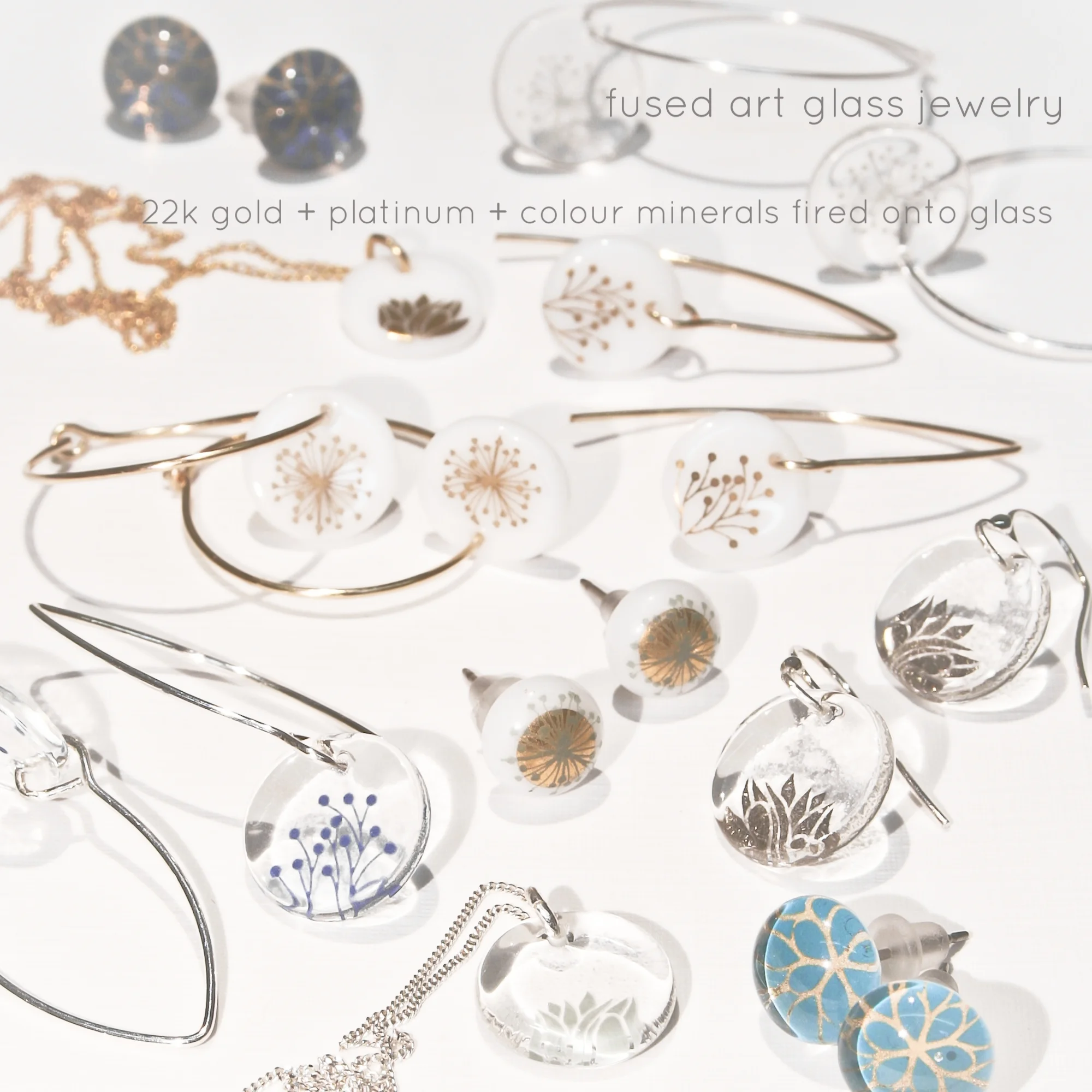 22k Gold, Platinum, and colour minerals decorate the glass by way of a silkscreen transfer process. In the heat of a kiln, all elements fuse together permanently. Each piece is finished with quality nickel-free Sterling Silver and 14K gold filled chains and findings.