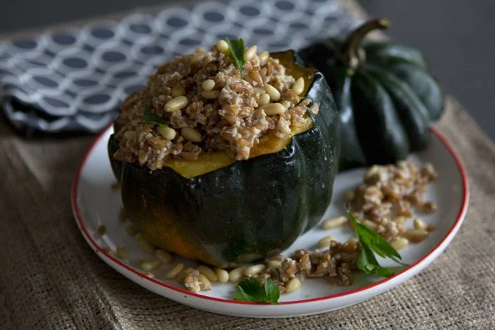 acorn squash stuffed with a warm farro and pine nut salad
