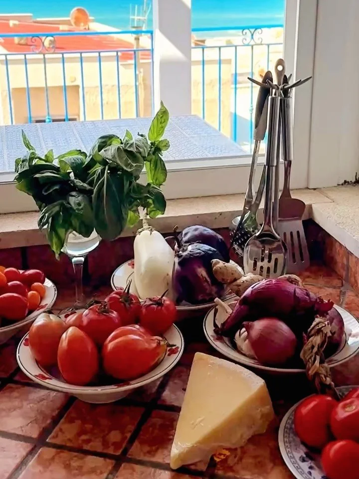little luxuries that matter most: cooking in a kitchen with a large window and gentle breeze / mounds of freshly picked castelvetrano olives / arancini + almond croissants for breakfast / pomodoro / wood fired sardines served on silver platters / lat