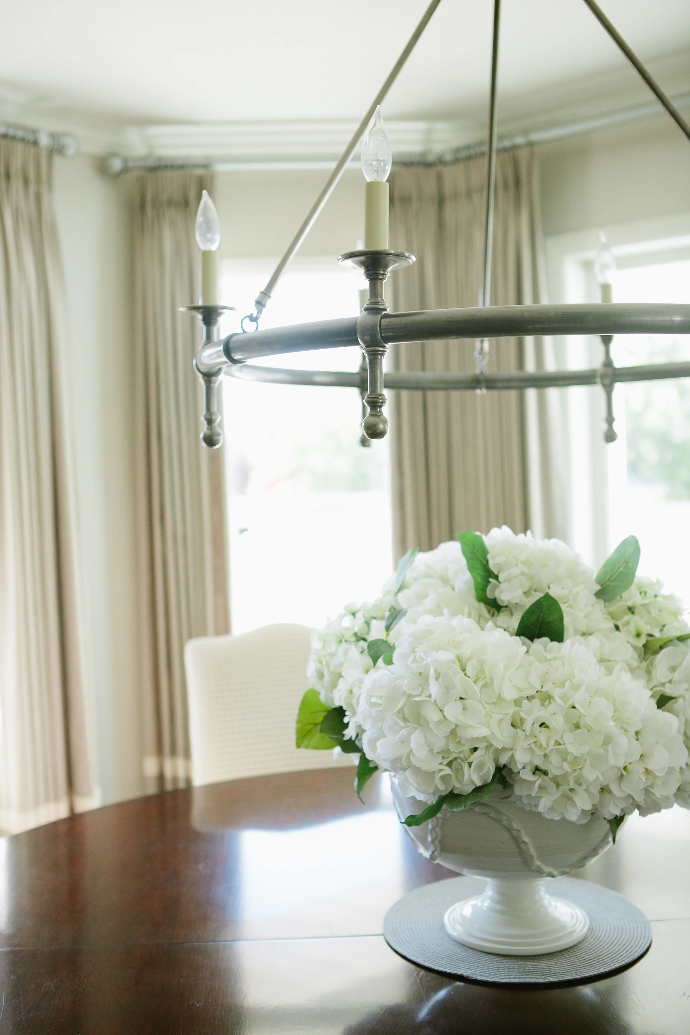 These gorgeous white hydrangea are always a favorite. They really make this dining space come alive! 