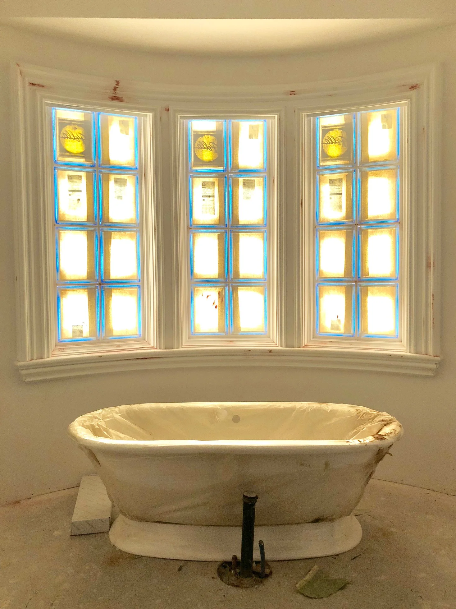 The master bathroom is big and beautiful, and this freestanding white porcelain bathtub adds a soft yet beautiful focal point that is easy to love. And could we love those windows any more?