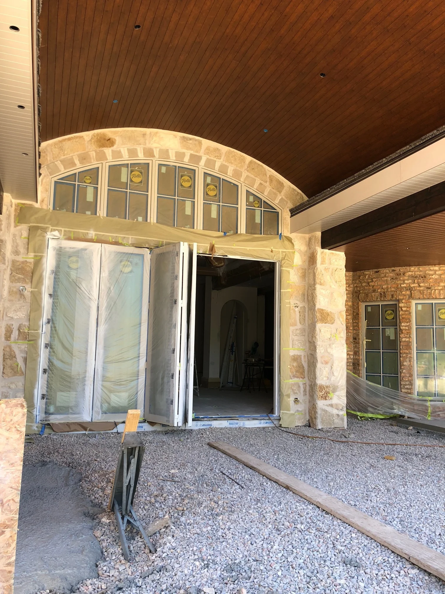 Finally, a shot of the back of the house! This folding door is accessed through the home's main living area and leads out to what will eventually be the backyard and patio. 