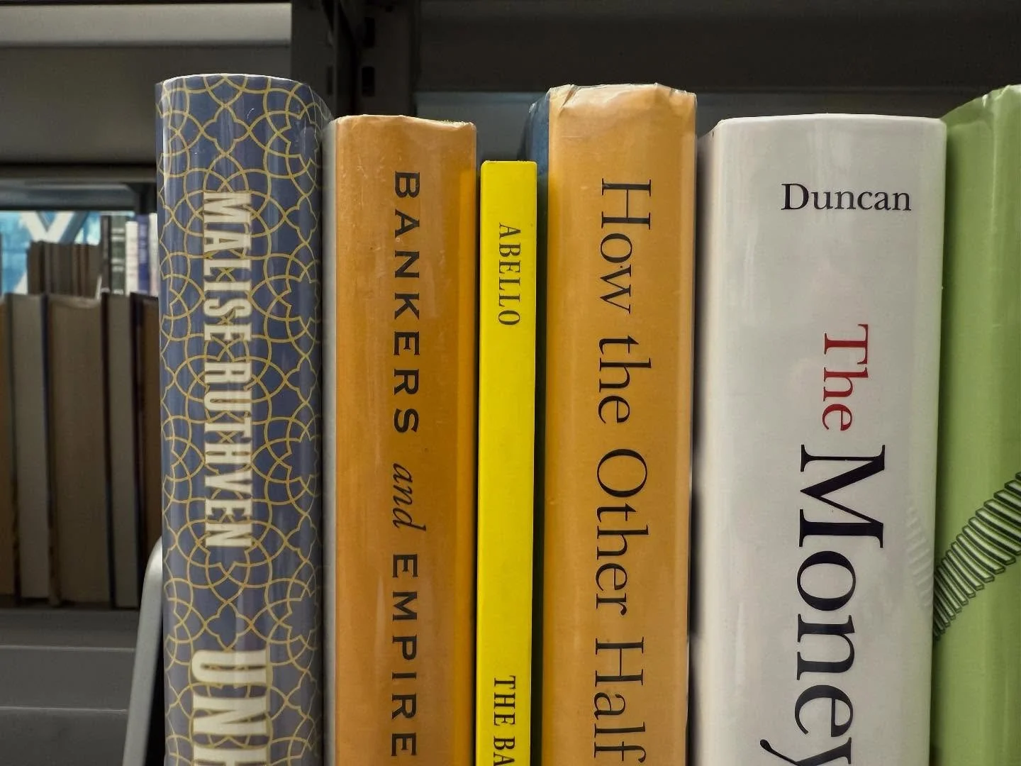 Another city, another library, another copy of my book! And next to one of my all time faves, by @mehrsabaradaran. @seattlepubliclibrary central library