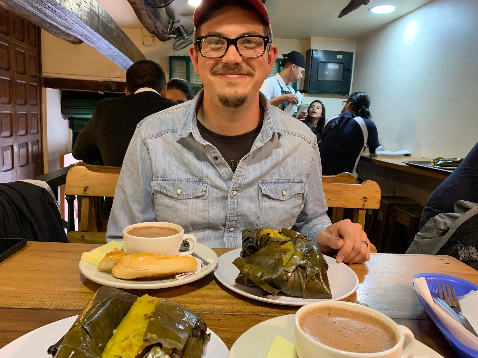 Justin very ready to dig into his giant tamal and wishing for me to stop taking photos already.