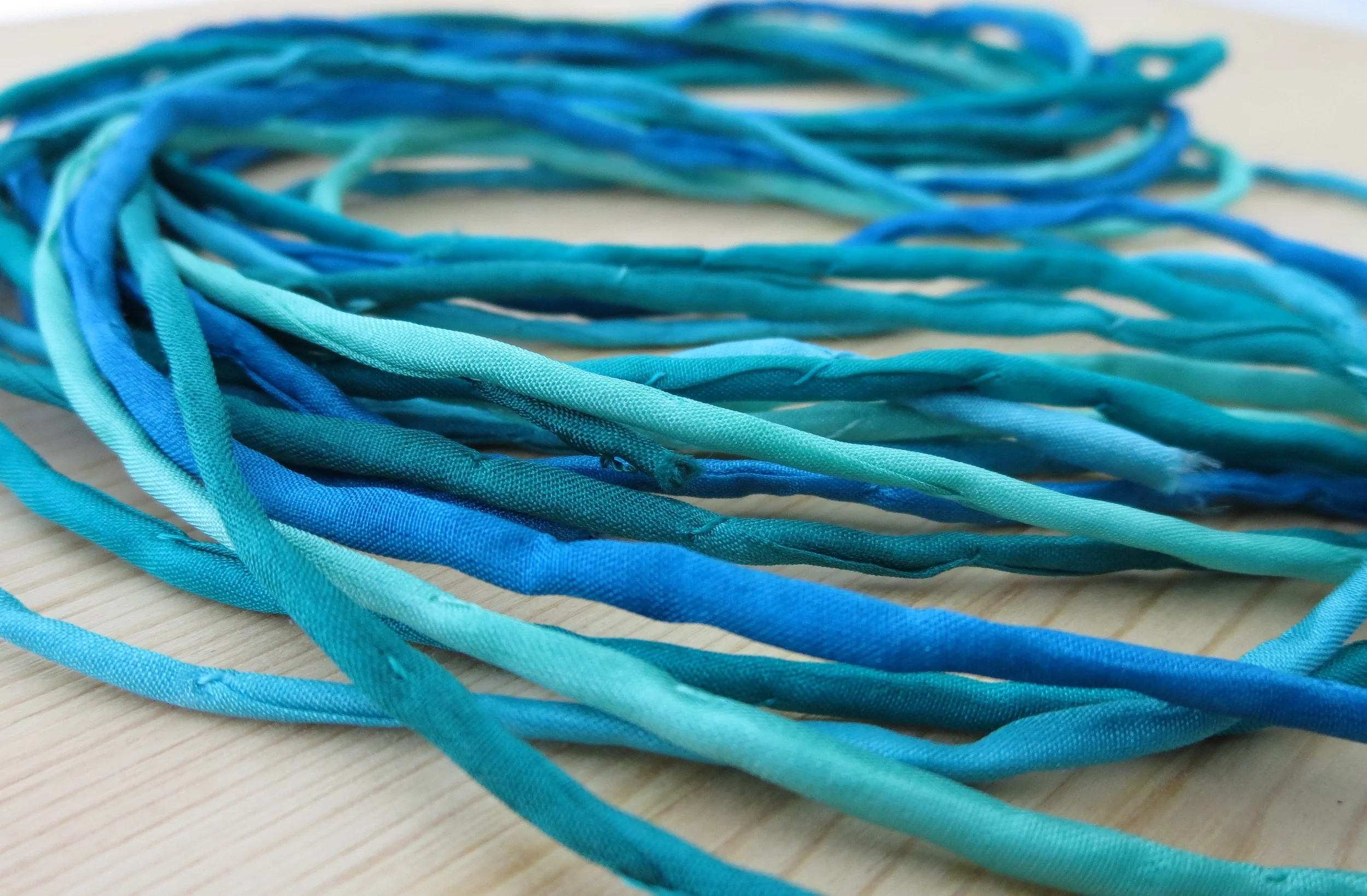 Thin Silk Cord Teals — The Buffalo Bead Gallery