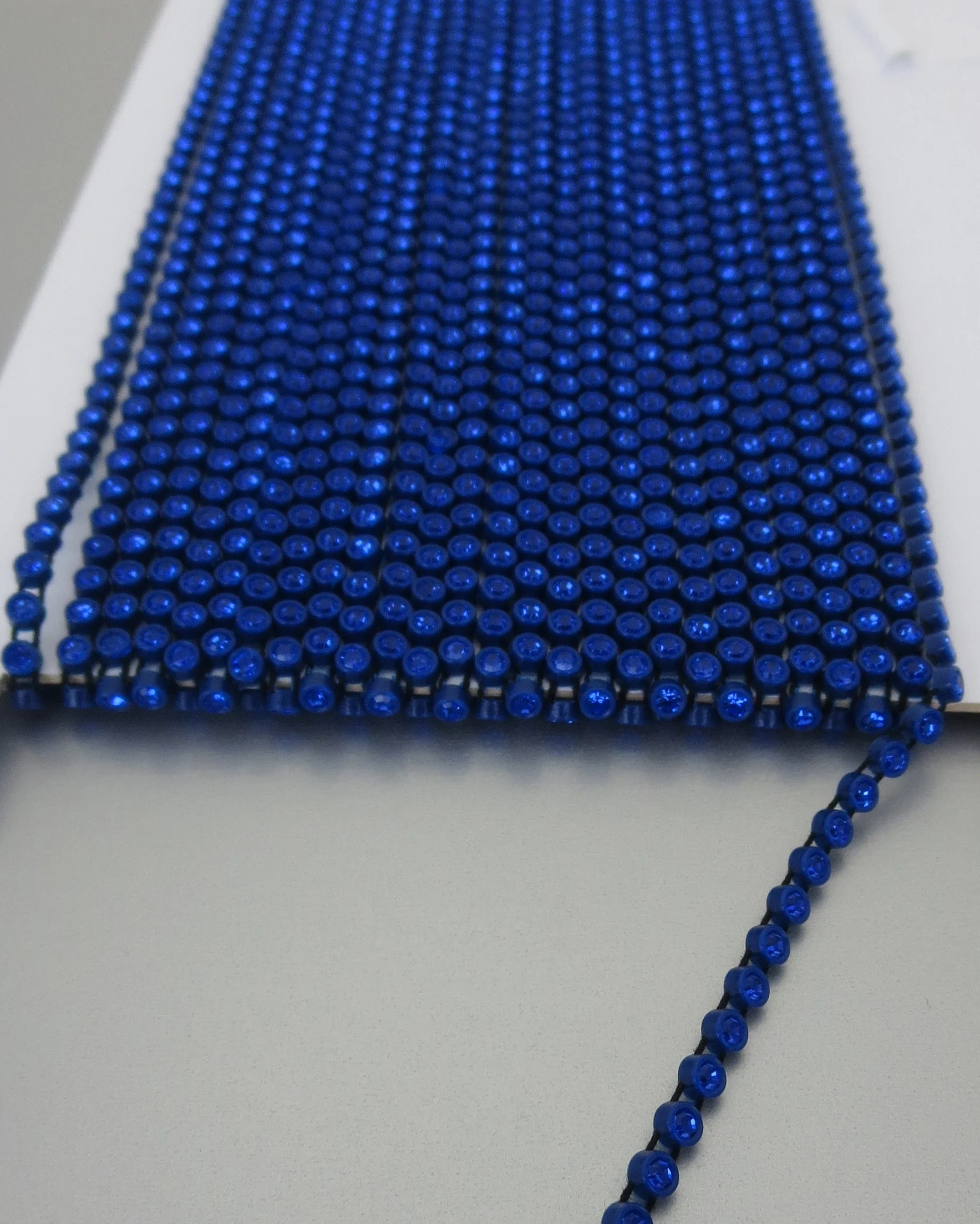 The Buffalo Bead Gallery. Plastic Cup Chain of Preciosa Crystal connected by parallel threads, flexible, open spaces allow for needle pass through.