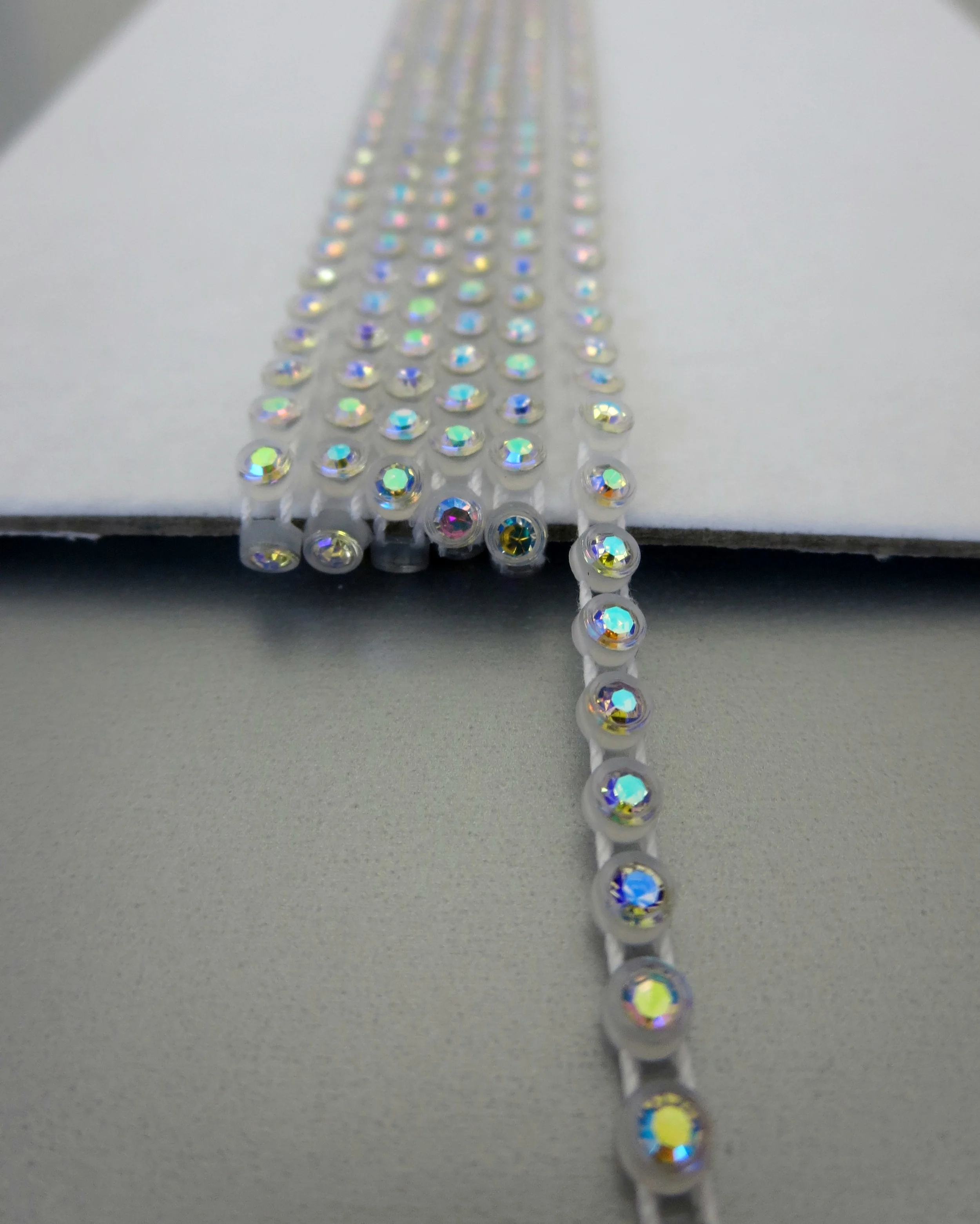 The Buffalo Bead Gallery. Plastic Cup Chain of Preciosa Crystal connected by parallel threads, flexible, open spaces allow for needle pass through.