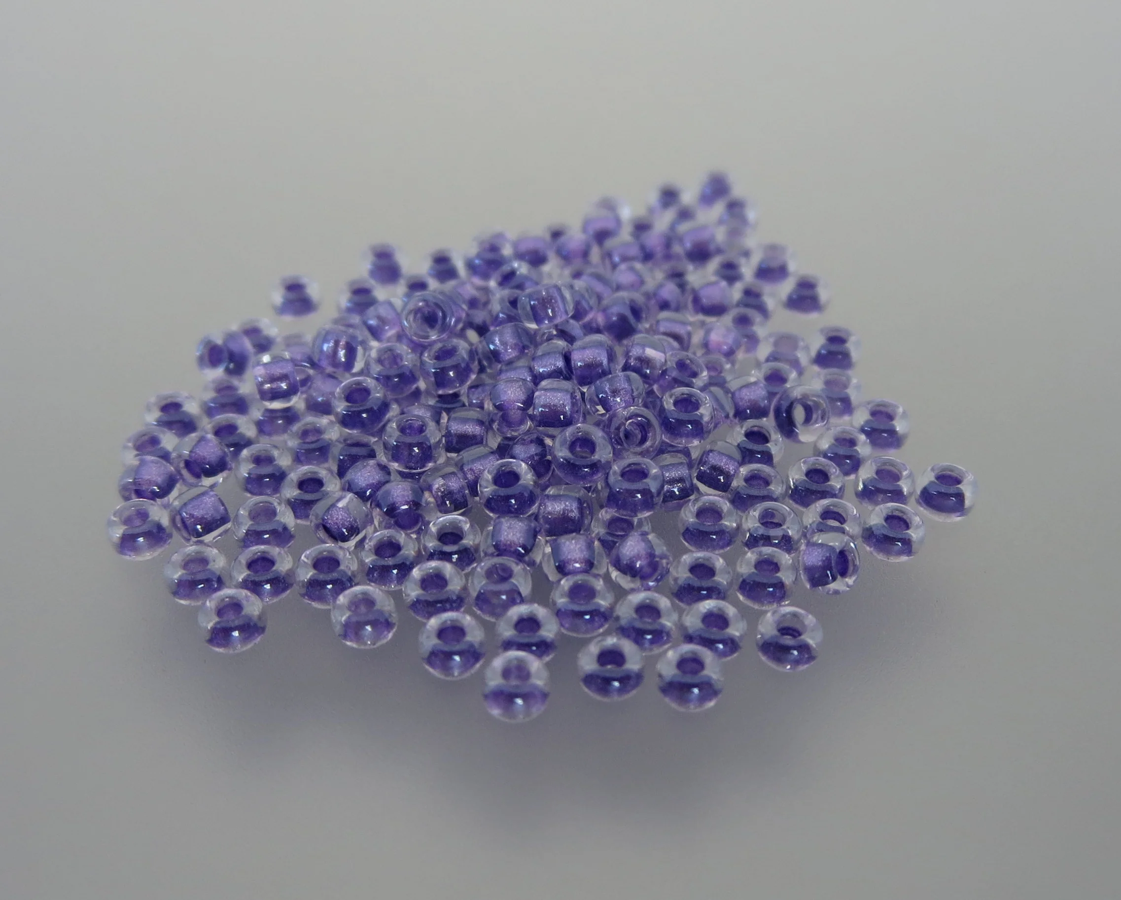 11º Japanese Seed Bead - Sparkle Purple Lined Crystal AB (#2607)