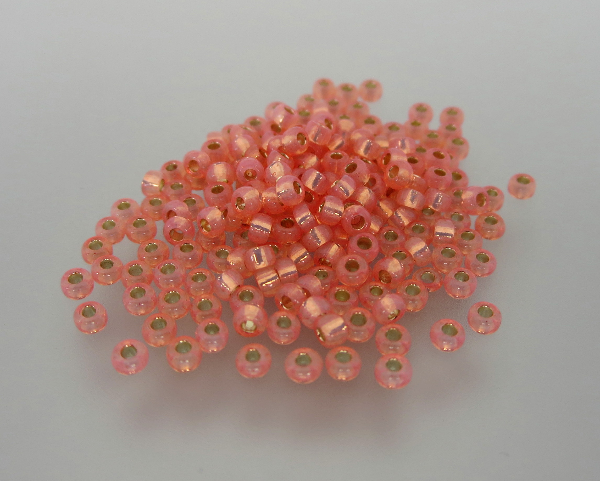 11º Japanese Seed Bead - Dyed Salmon S/L Alabaster (#642)