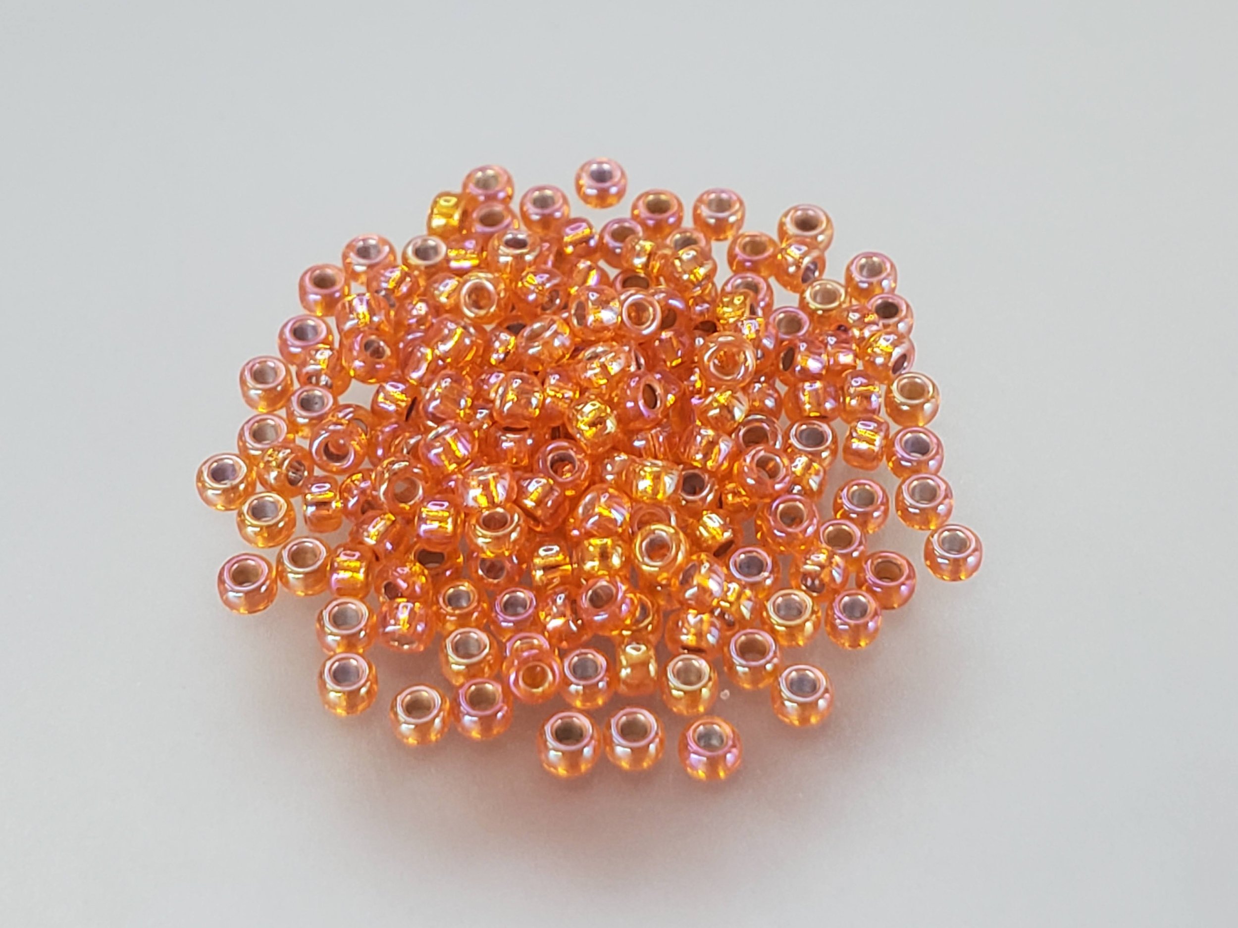 11º Japanese Seed Bead - (#1008) Silverlined Orange AB