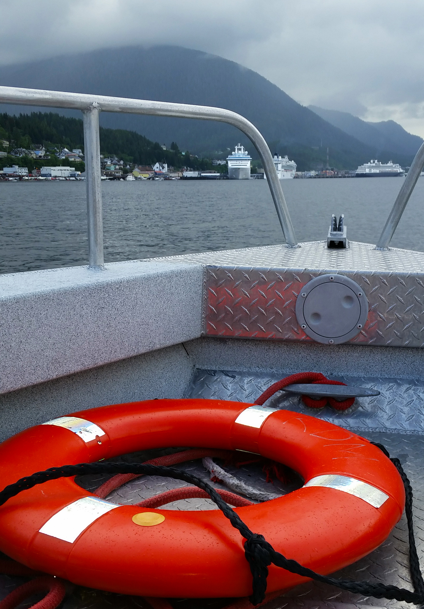  A misty day in the Tongass Narrows and cruise ships at the dock in Ketchikan, Alaska. 