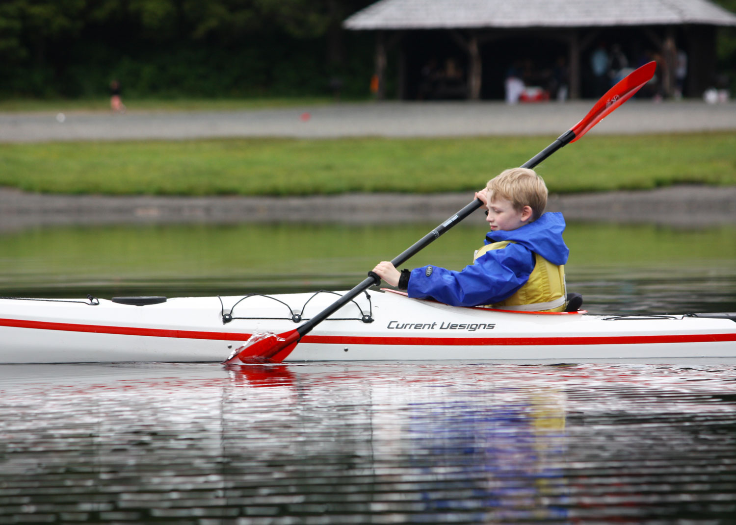  7 years old: kayaking on Ward Lake in Current Designs' Raven kids kayak. 