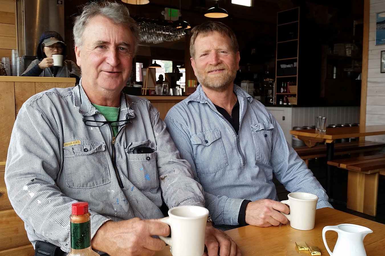  Southeast Sea Kayaks' Owner Greg Thomas shares a cup of coffee with Chuck Slagle at Chuck's restaurant, The Alaska Fish House. 