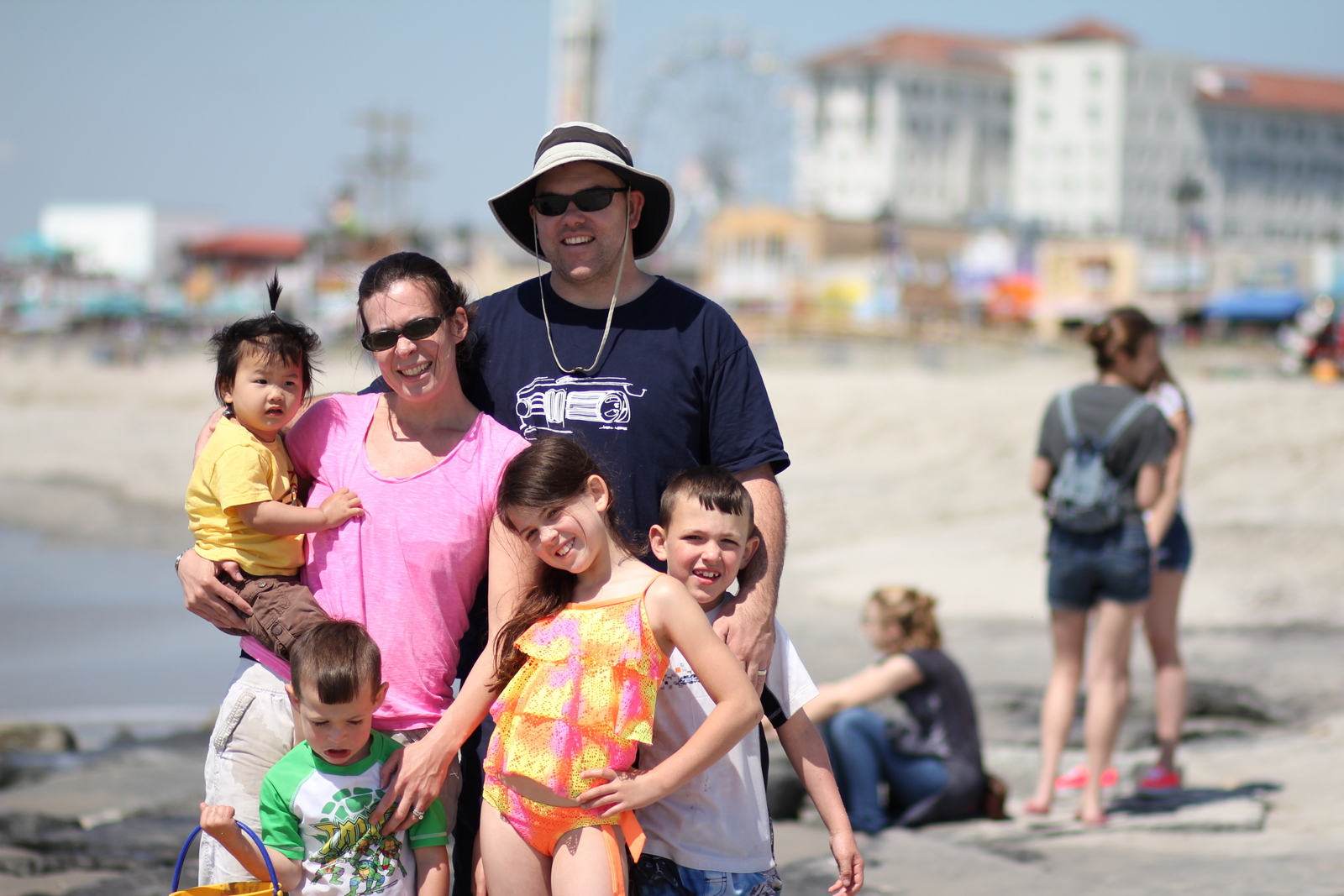My happy family of 6! Oh wait, not Trevin, he's mad we took him away from his sand castle. 