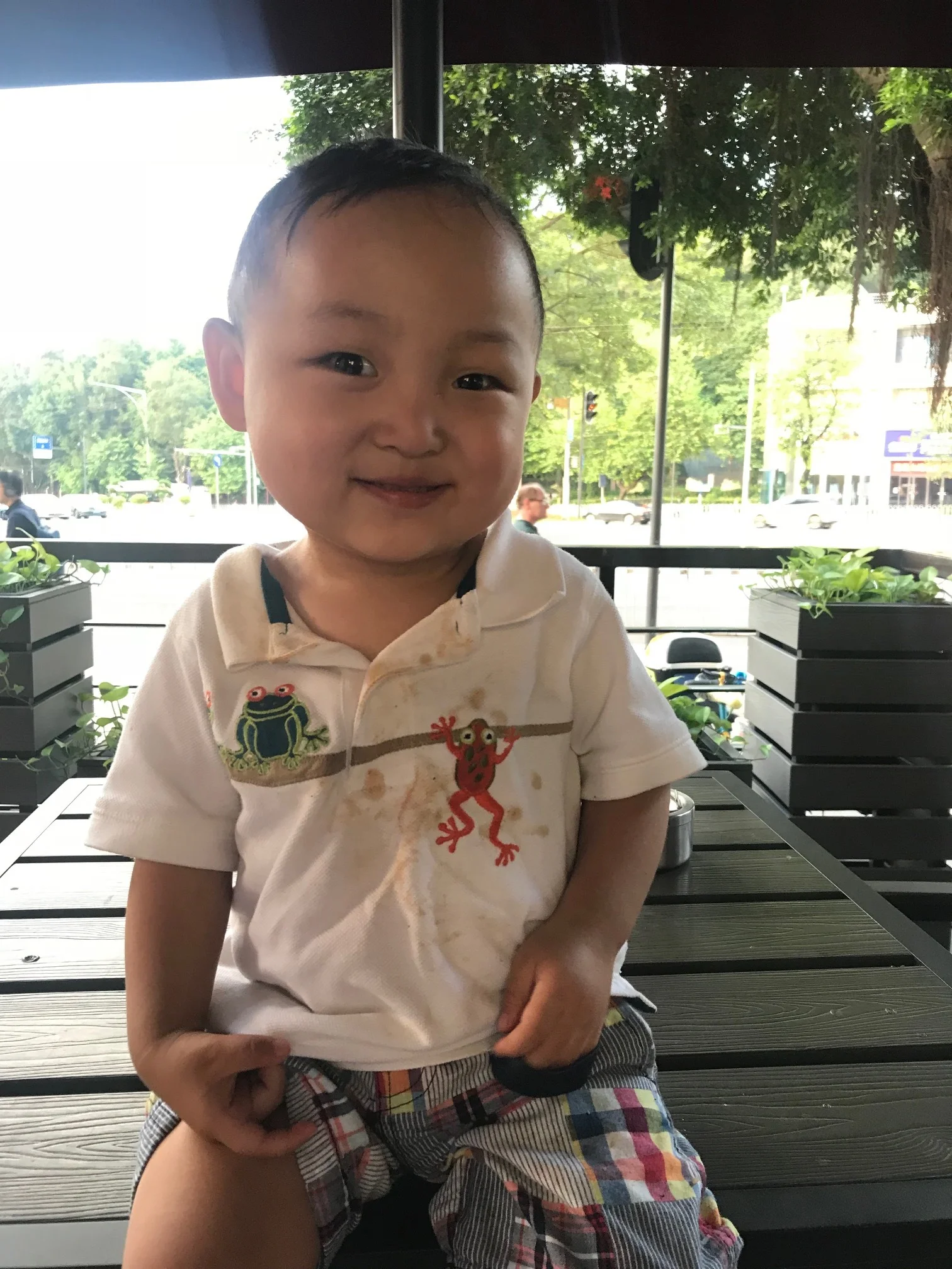 Wearing breakfast, lunch and dinner on his white shirt.