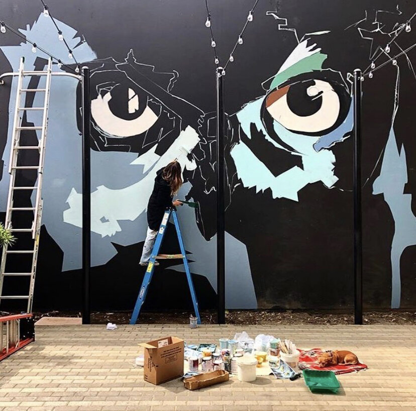 Nicky Painting Owl Mural.jpg