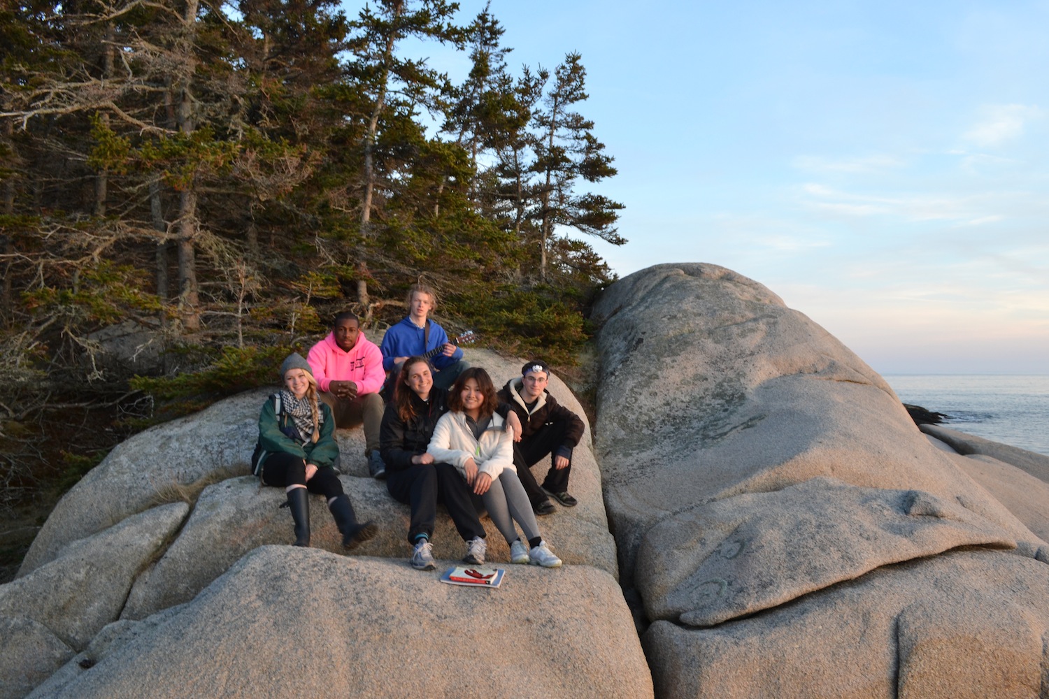 Students enjoy a great view of the sun setting across the bay