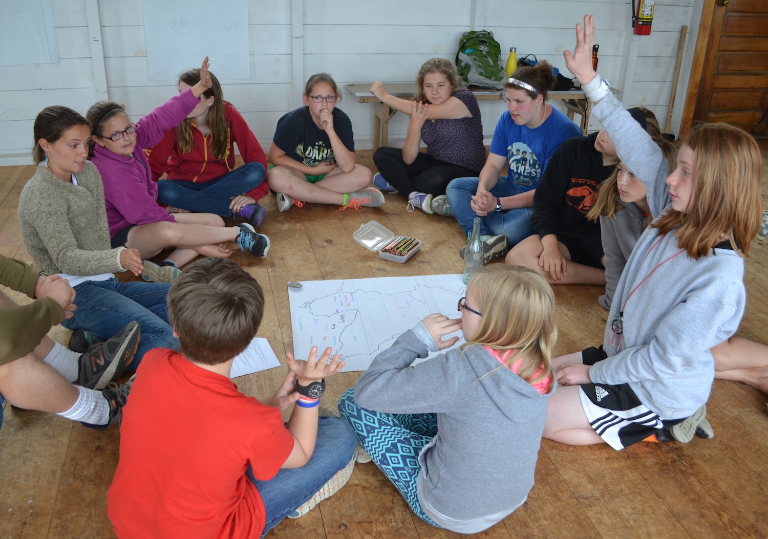 Students work with Josie to come up with words and attitudes they want to keep on and off Hurricane during their program