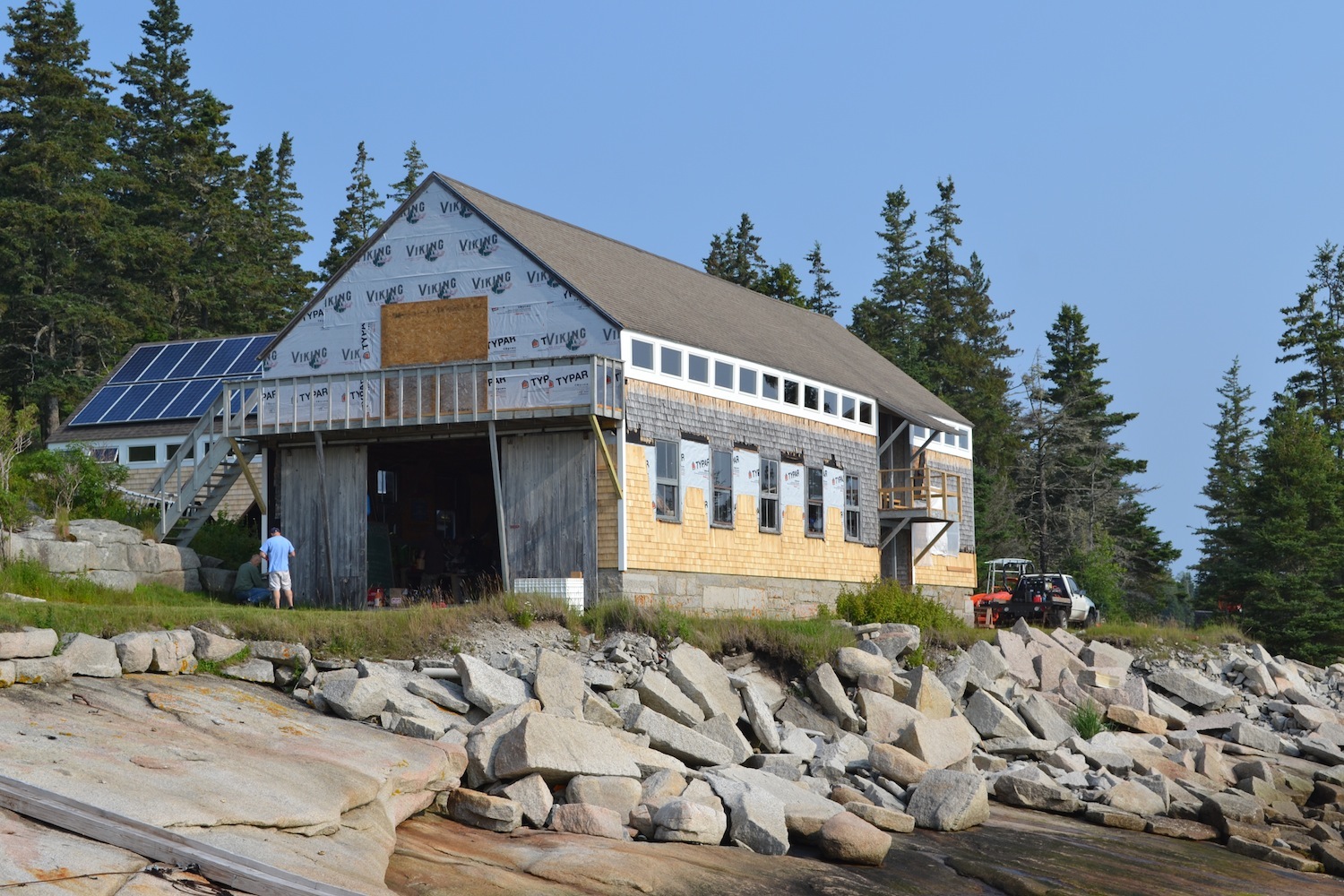 Installing new windows and re-shingling the boathouse