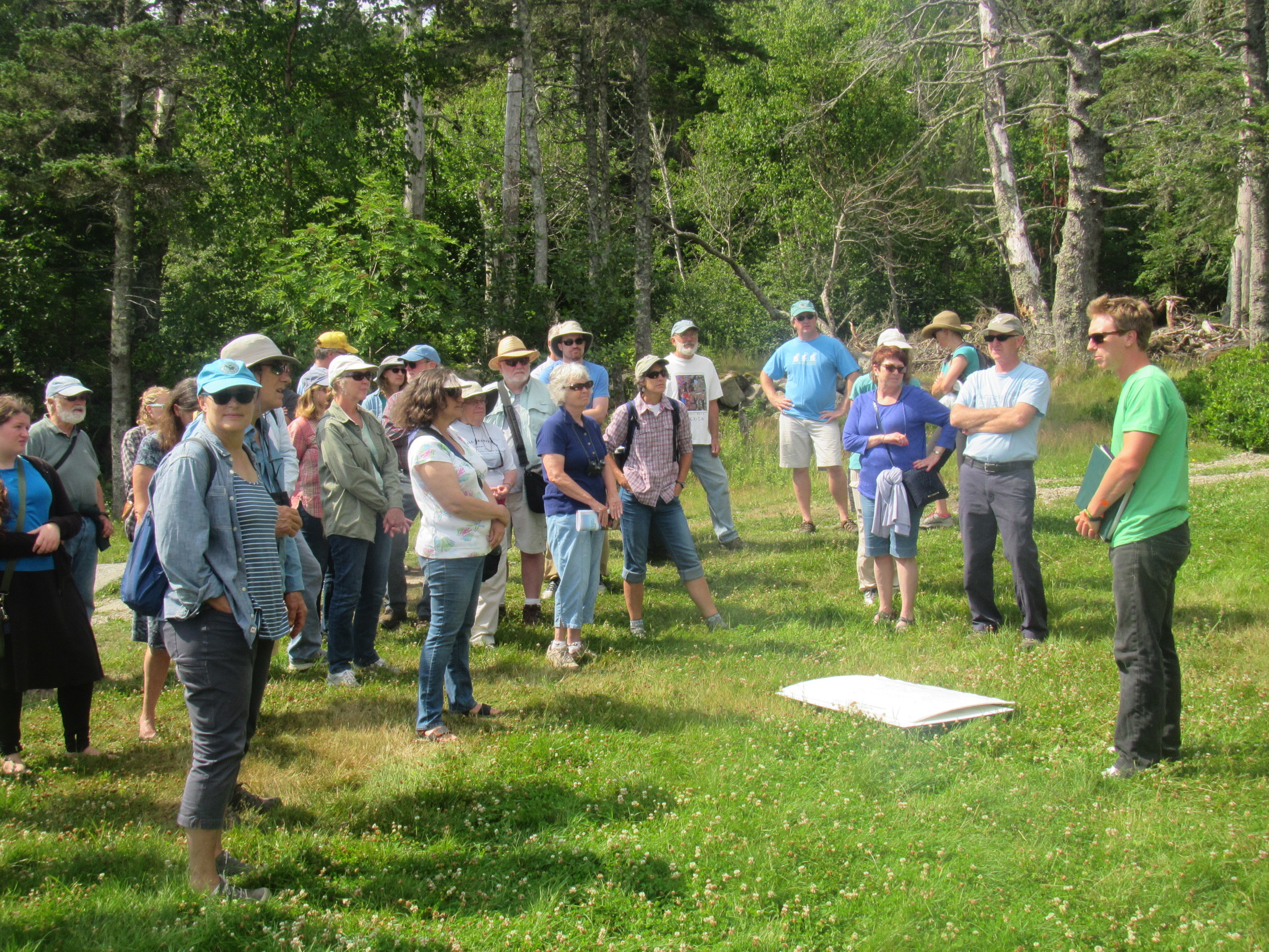 Vinalhaven Land Trust participants touring the facilities with Facilities Manager Oakley Jackson