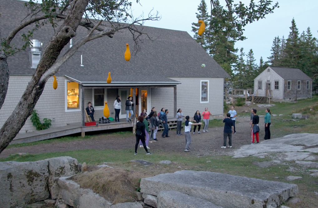 Group volleyball at dusk