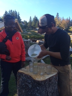 TIOBEC Vice President of Education, Nikki Tabon, is served fresh pressed Hurricane cider