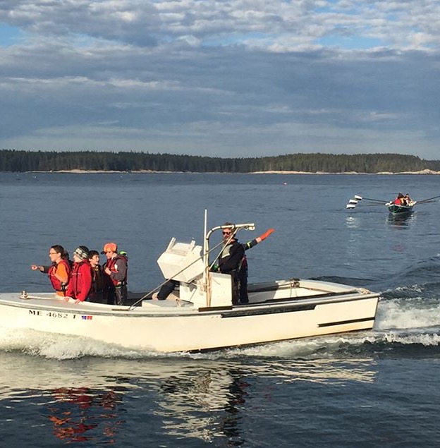 Students learn about the anatomy of lobsters and the lobster fishery in Maine while hauling up traps with Oakley.
