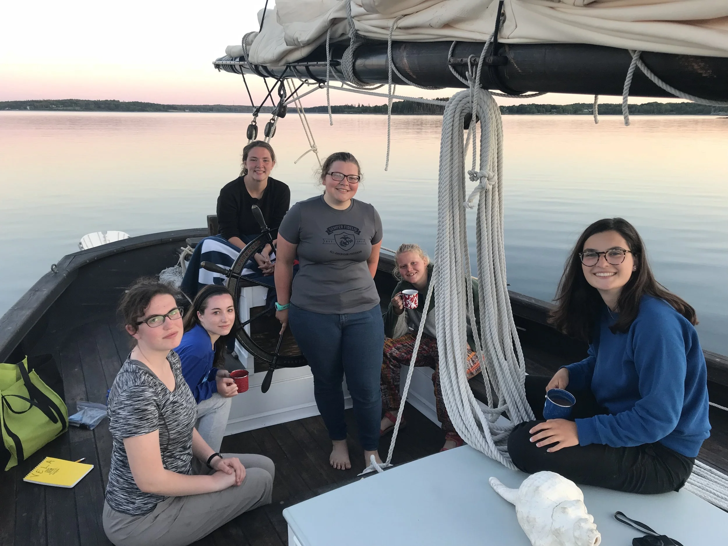 The first half of the group to sail aboard the Vela, enjoying a beautiful sunset.