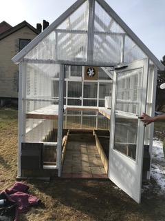 Photo of the finished greenhouse, in time for starters of kale and mesclun salad mix.