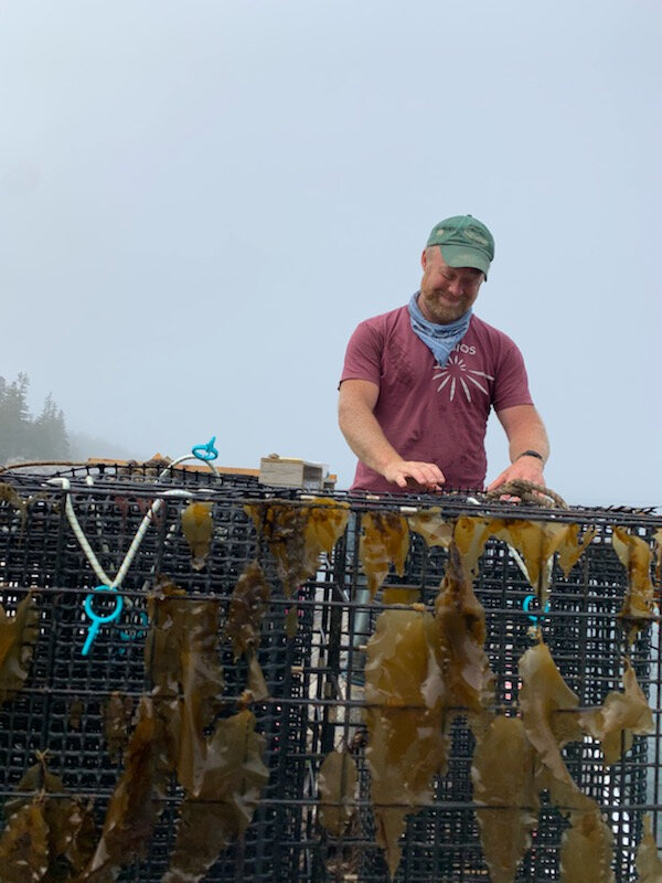 Me with one of our scallop cages that needs to be sorted and cleaned.