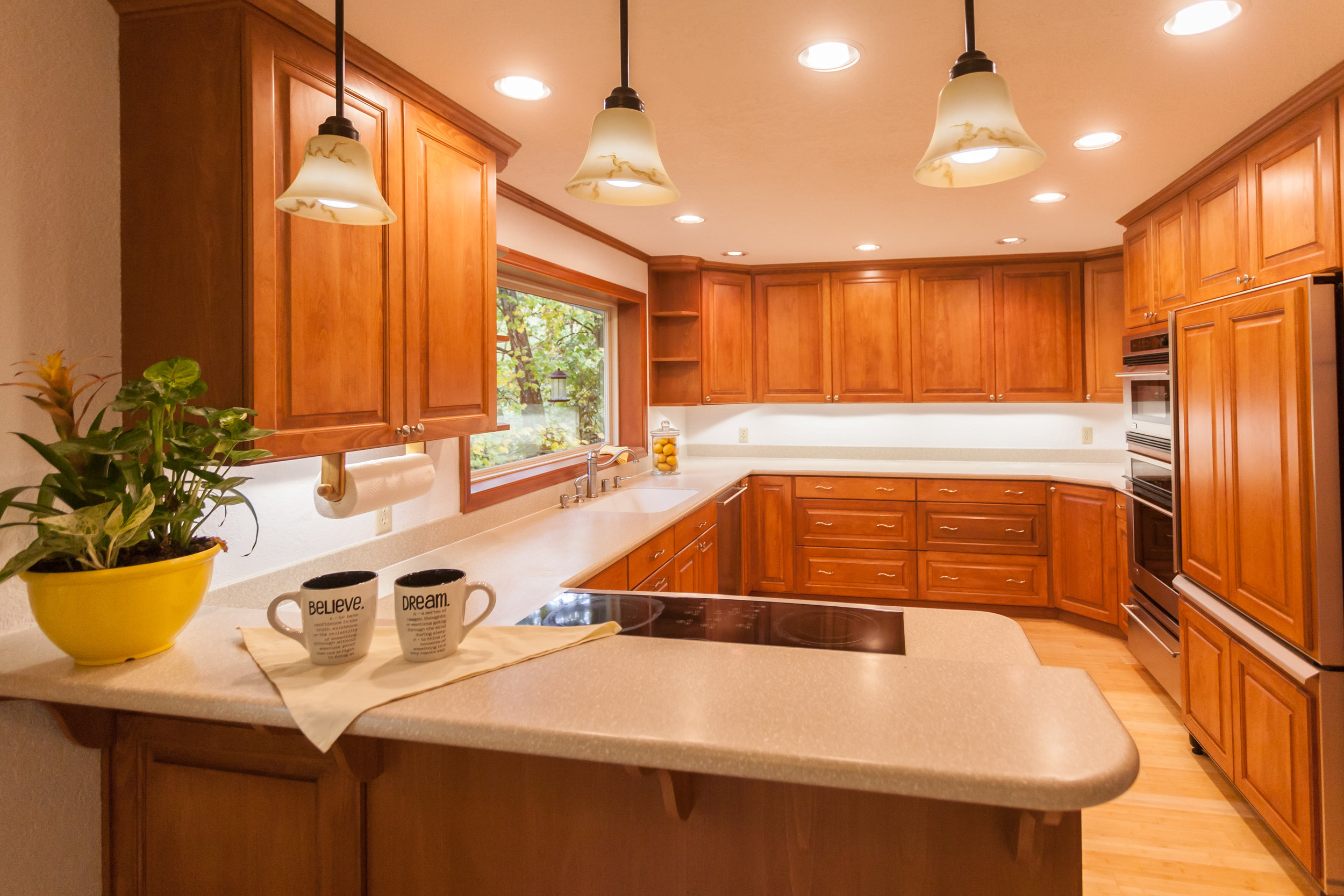  Kitchen has it all. Stainless appliances. Corian countertops. No Ikea cabinets here! Full wood and special-ordered. Look out at the trees and yard from every window in the house...especially at the kitchen sink! 