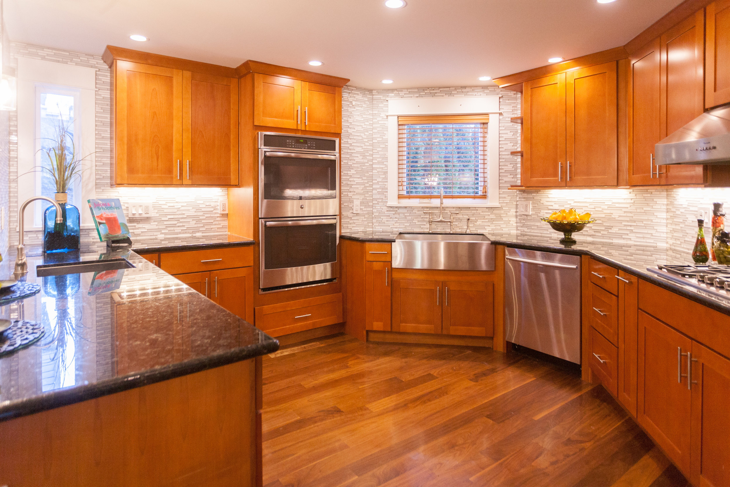  Cabinet space, newer stainless steel appliances, 5-burner gas stove top,  double-oven, and a tasteful backsplash all make for an intuitive,  high-end kitchen. 