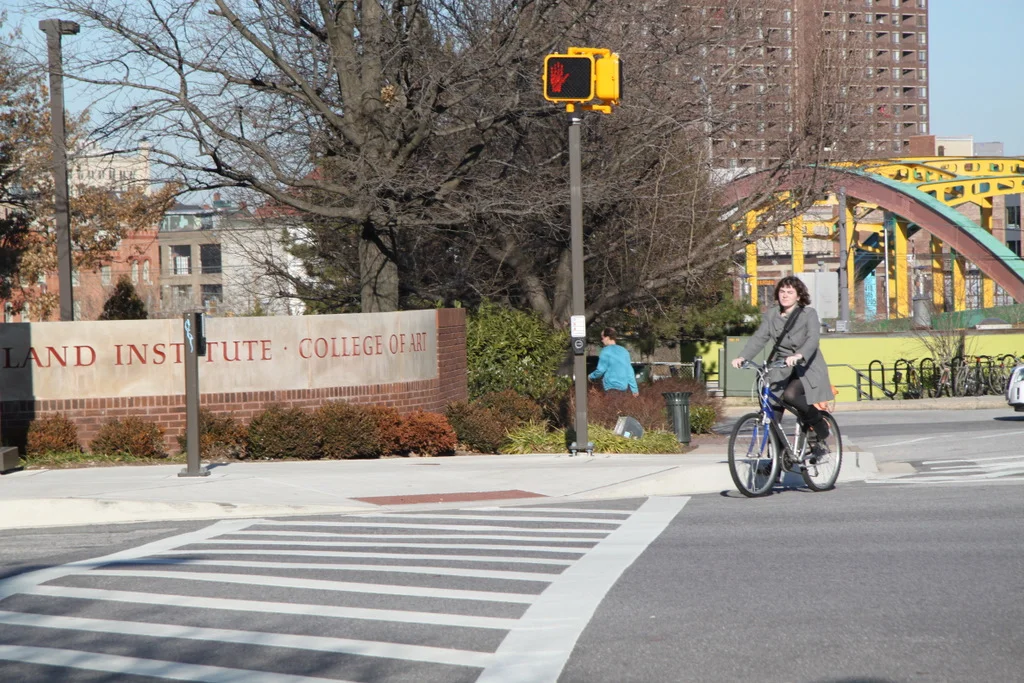 A person riding a bike crosses Mt. Royal. Photo Credit: Fern Shen-Baltimore Brew