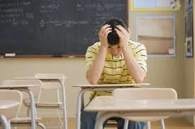 teen boy in class looking down.jpg