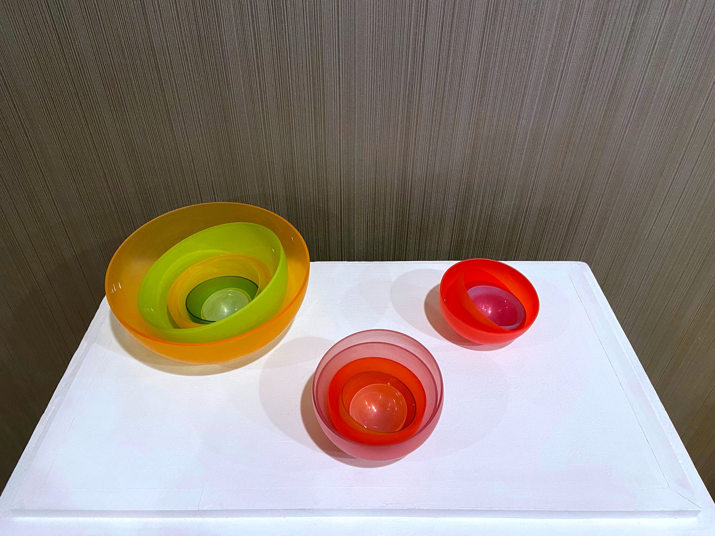  Left to right:   Nesting Set of 8 Bowls , 2024, Blown Glass, $1400.   Nesting Set of 5 Bowls 1 , 2021, Blown Glass, $600.&nbsp;   Nesting Set of 5 Bowls 2 , 2021, Blown Glass, $650.  Photographed by Emily Venne, edited by Au7umn. 