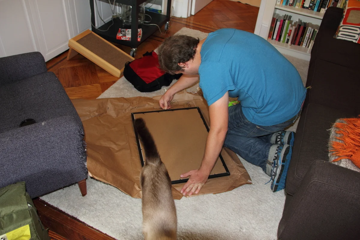   Our
 client had several pieces of art that needed to be framed and hung. Now
 that Oliver has approved the framing process - off to take a cat nap.      