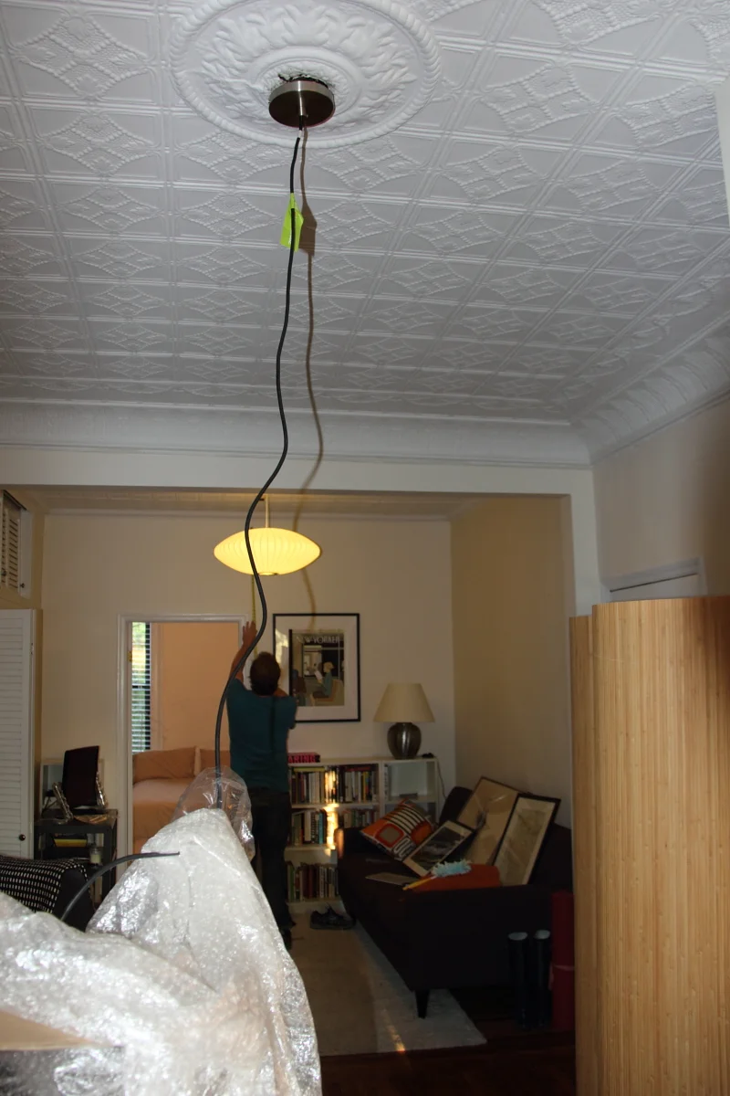    Now that the Nelson Saucer light has been installed, it's time for the CB2 globe pendant.      