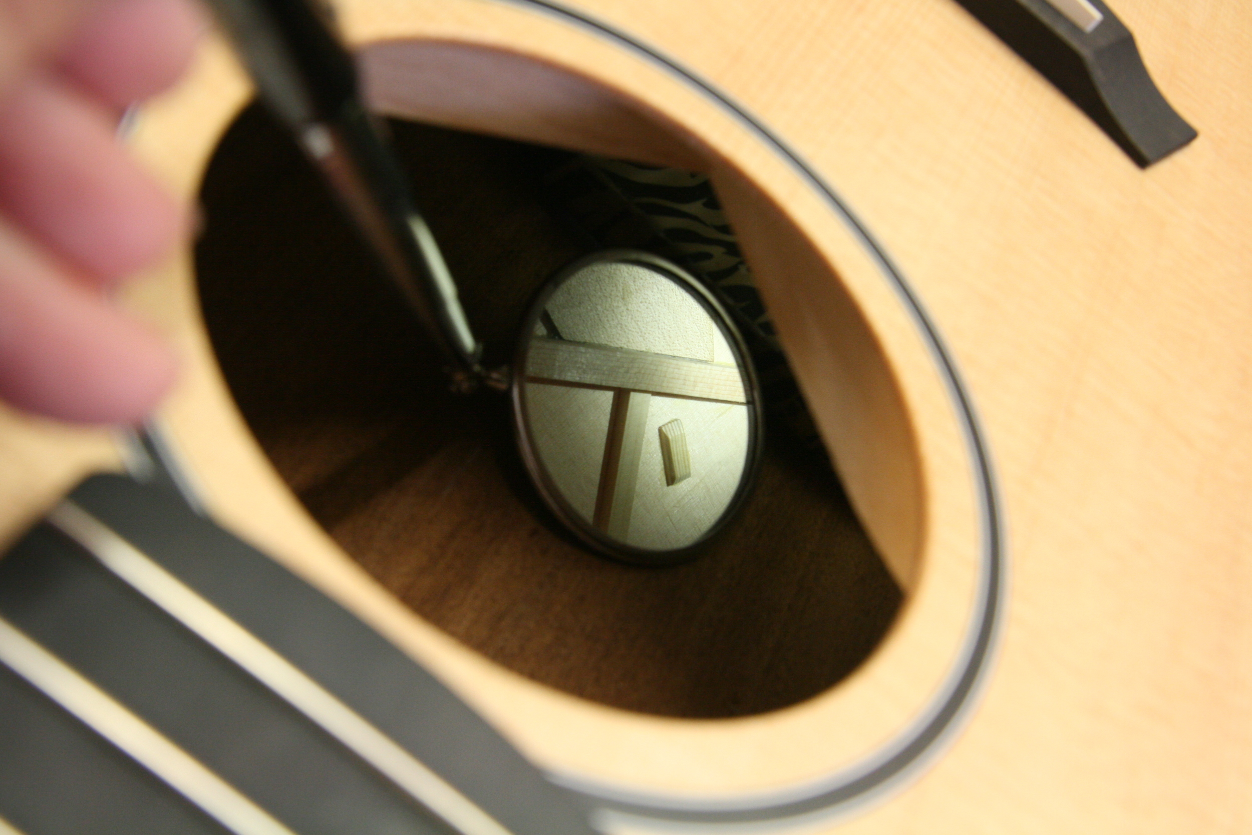 Acoustic guitar repair, cracked top supported with a cleat