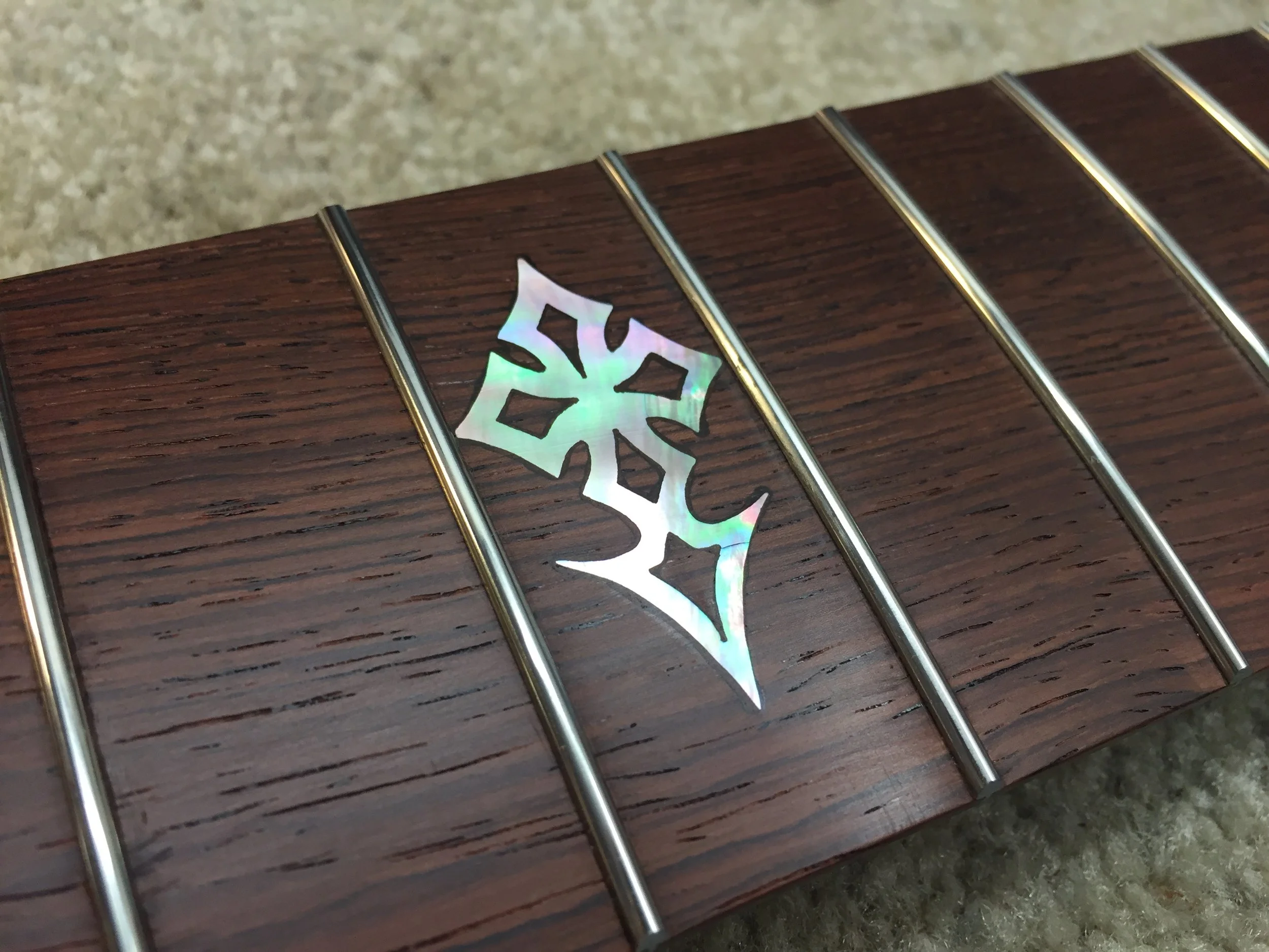 Custom inlay in black mother of pearl